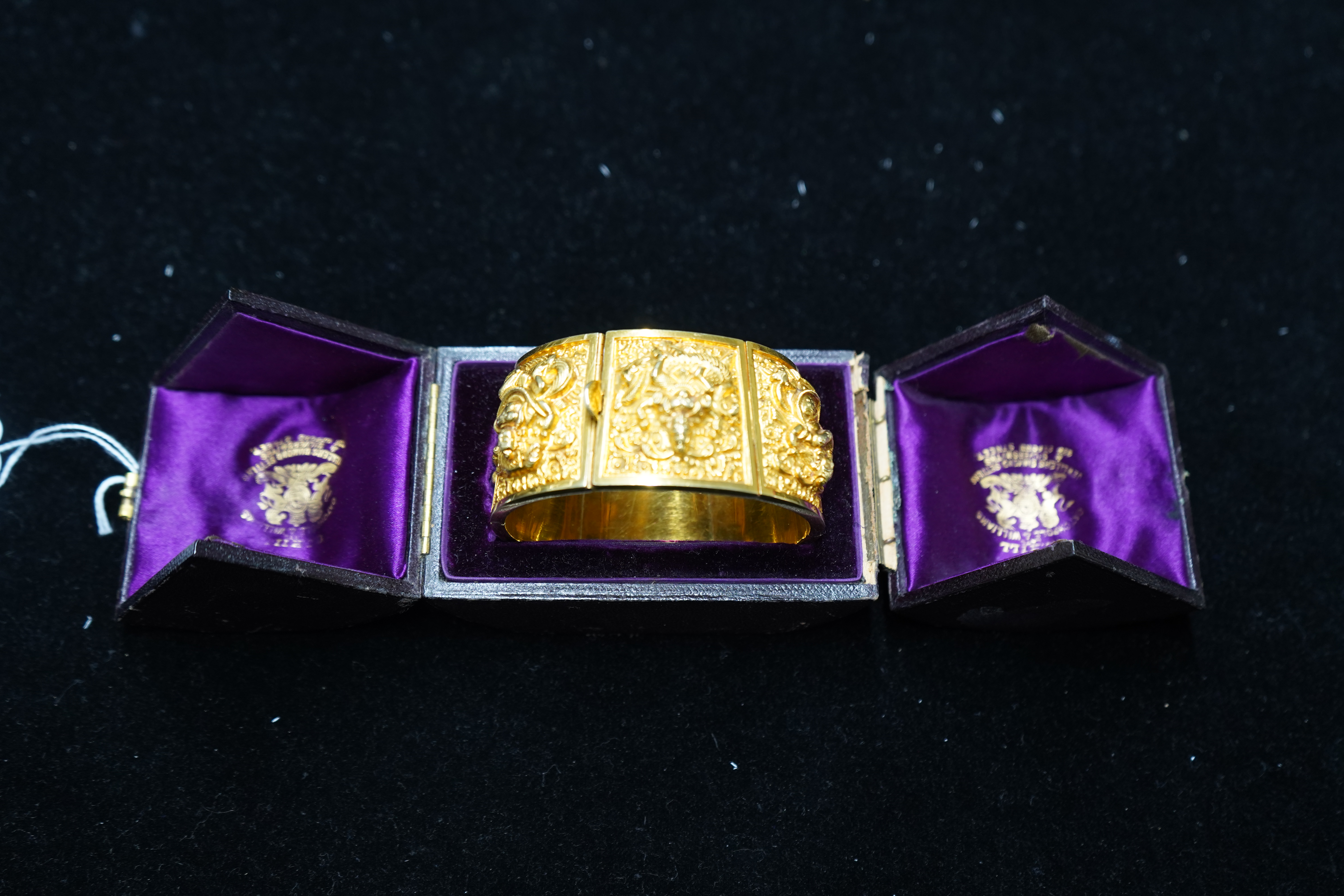 An early 20th century Indian gold hinged panelled cuff bracelet